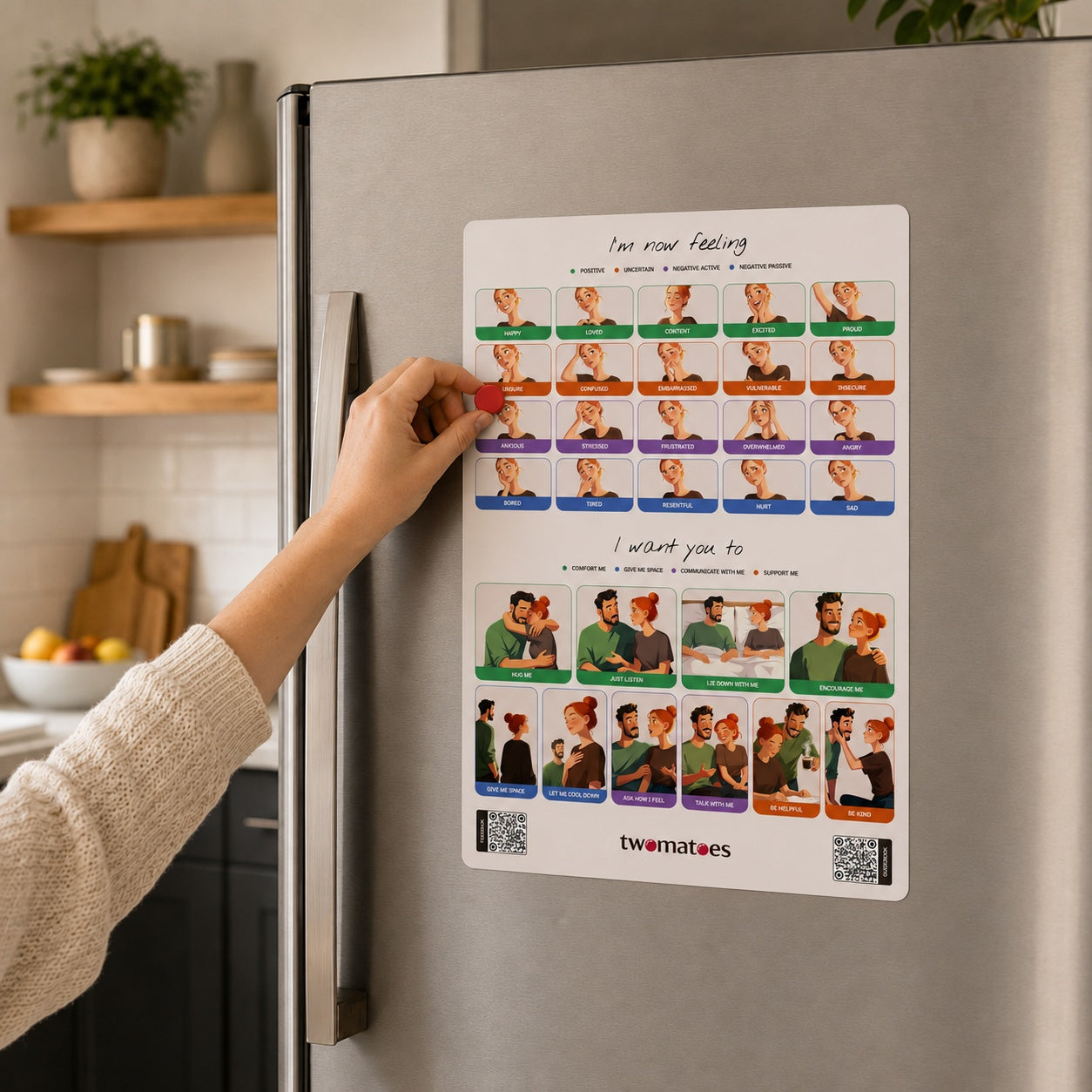 Woman placing a red magnet on the Twomatoes Emotion Board to show how she feels