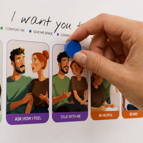 Close-up of a blue magnetic pin marking “Talk with me” on the Twomatoes Emotion Board for couples.